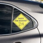 Baby On Board Sticker Sign – Essential for Cars – 2 Pack, 5.5″ by 5.5″ – Bright Yellow and See-Through When On Window – Cute Safety Signs – No Need for Suction Cup or Magnet – Durable Strong Stickers